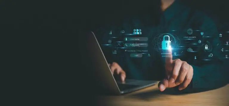 A person using a laptop on a wooden table touches a glowing padlock icon on a semi-transparent interface displaying CMMC icons and login credentials. The dark background highlights the interface, emphasizing cybersecurity and data security.