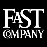 The image features the logo for Fast Company. The text is in white, bold, elegant serif font on a black background, with "FASt" displayed prominently in a larger, stylized design and "COMPANY" in smaller, uppercase letters below, evoking a sense of sophistication akin to leading cybersecurity brands.