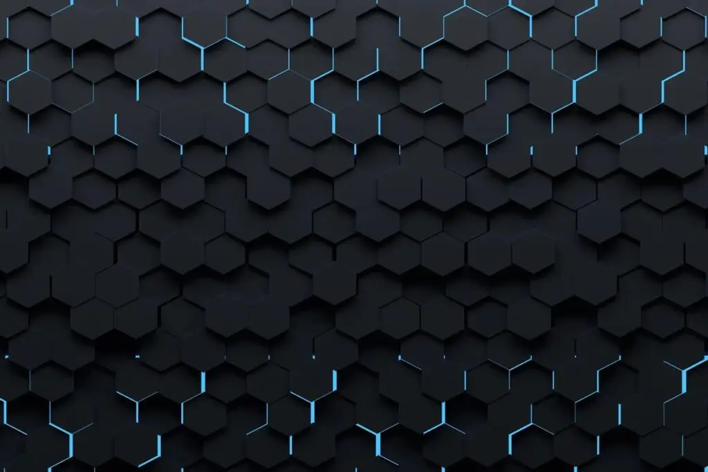 A dark hexagonal honeycomb pattern with a 3D effect, featuring subtle glowing blue lines along some edges. The hexagons vary slightly in height, creating a layered, geometric texture reminiscent of advanced cybersecurity measures to counter cyberthreats in DOD's CMMC framework.