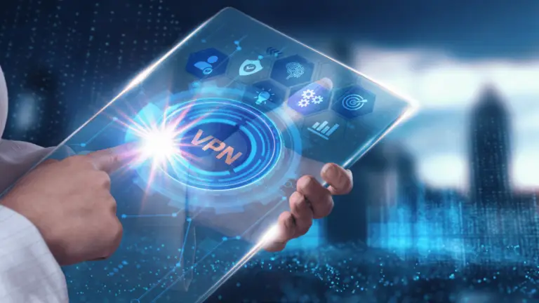 A person is touching a transparent, futuristic digital tablet displaying the word "VPN" at its center. Surrounding the VPN icon are various cybersecurity-related icons. The background shows a blurry cityscape with illuminated blue and white lights, symbolizing the essence of CMMC standards in modern tech.