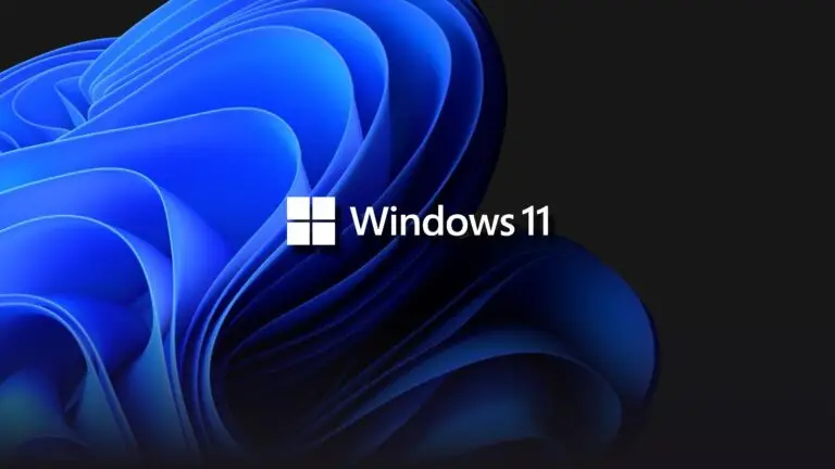 The Windows 11 logo is displayed over a sleek, blue abstract background with curved, layered shapes. The image features the Microsoft Windows logo with "Windows 11" text in white, prominently centered. It's a visually striking representation that underscores the importance of cybersecurity in today's digital age.