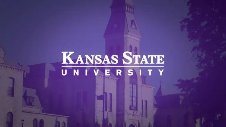 Image of Kansas State University with a prominent stone building and tall tower in the background. The text "Kansas State University" is prominently displayed in white font across the middle of the image against a purple background. Stay informed about cybersecurity to protect against potential cyberthreats.