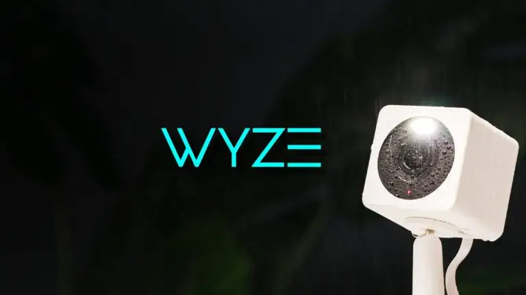 Wyze logo in blue next to a white camera on a stand against a dark, blurred background, emphasizing secure surveillance amidst cyberthreats.