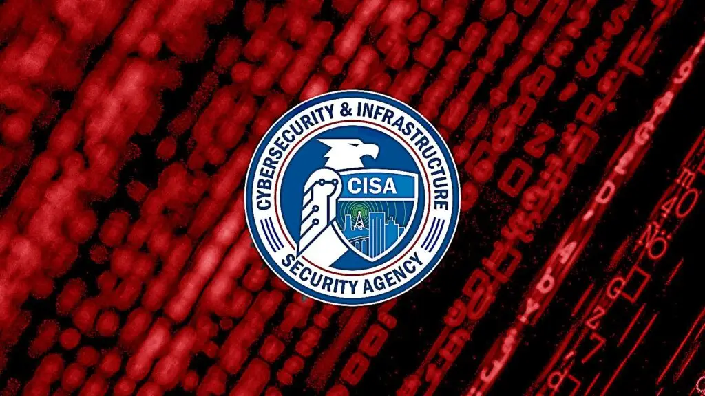 The image features the Cybersecurity and Infrastructure Security Agency (CISA) seal centered over a dark red background with abstract digital patterns resembling binary code and circuitry, evoking a sense of vigilance against cyberthreats.