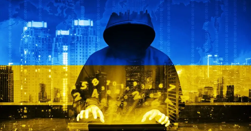 A figure in a dark hoodie, face obscured, types on a keyboard with floating numbers and symbols. The background shows a cityscape with buildings and a digital overlay, hinting at potential cyber threats. The image has a blue and yellow color scheme, resembling the Ukrainian flag.