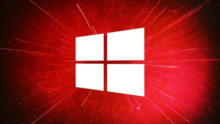 A white Windows logo consisting of four quadrants is centered on a red background with radial light streaks emanating from the center, giving a dynamic burst effect. With its textured, starry appearance, it subtly emphasizes the importance of cybersecurity in combating ever-evolving threats.