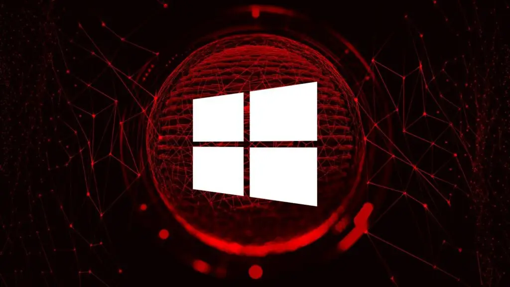 A white Windows logo is centered against a dark background with a red network-like design. The interconnected red lines and nodes, reminiscent of a VPN structure, frame a glowing red sphere behind the logo, creating a futuristic and digital aesthetic that hints at CMMC compliance.