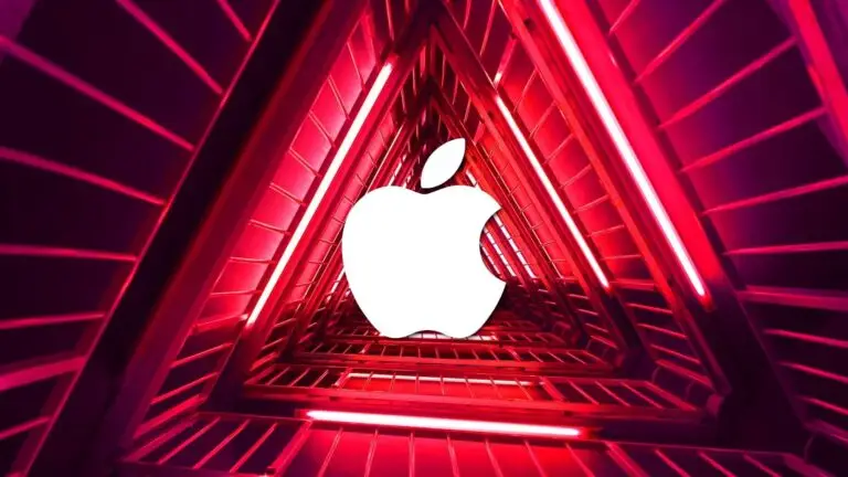 A glowing white Apple logo is centered within a symmetrical, neon-lit triangular tunnel. The tunnel features a deep red and pink color palette with repeating triangular shapes, evoking a futuristic, tech-savvy aesthetic reminiscent of cybersecurity environments and VPN networks.